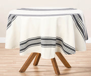 A navy  round tablecloth adds elegance and style to any dining experience, whether indoors or outdoors.