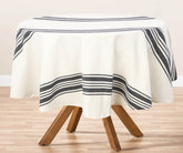 A navy round tablecloth adds elegance and style to any dining experience, whether indoors or outdoors.