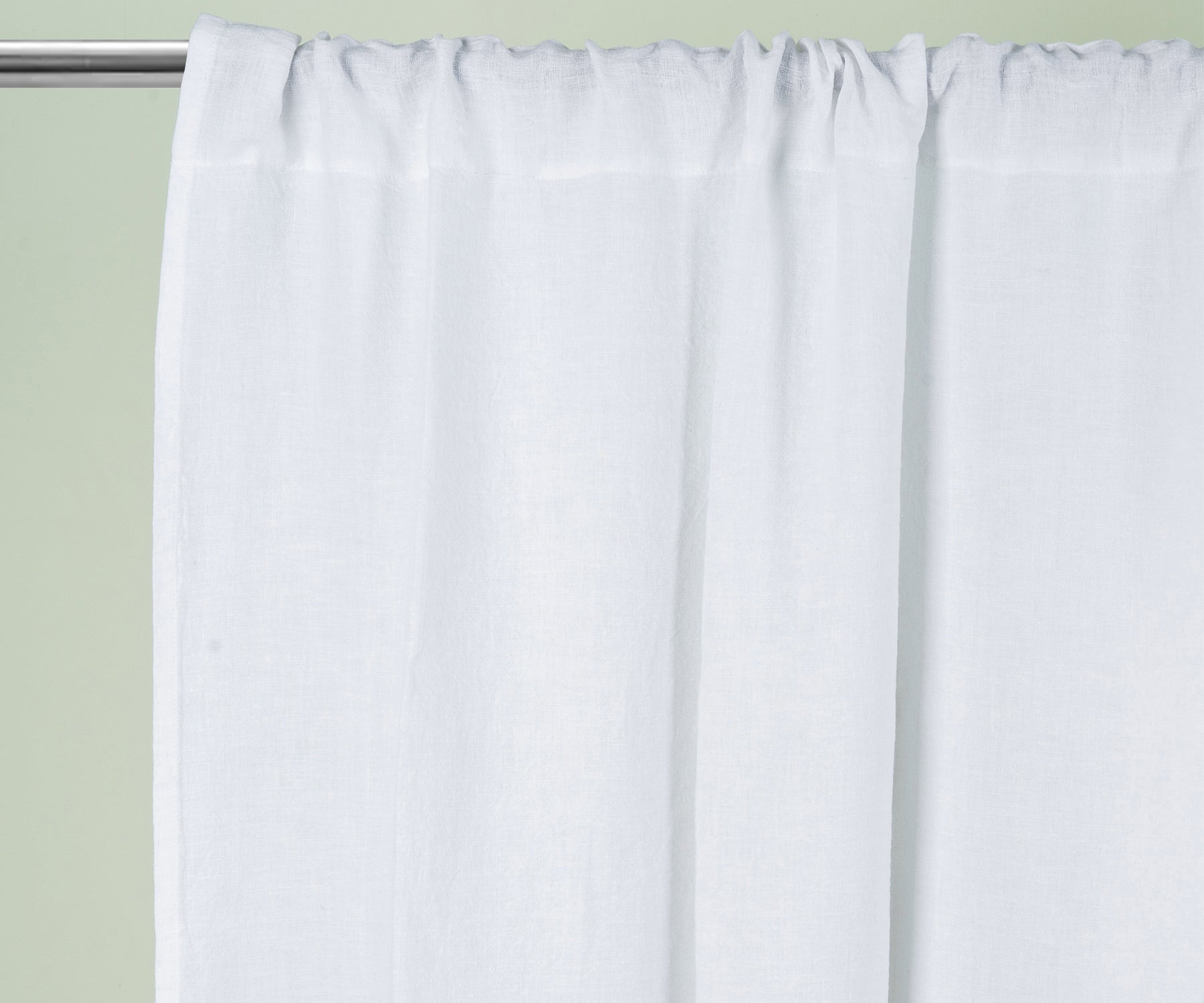 White 100% linen curtains with subtle stripe detail, styled in a bright living room