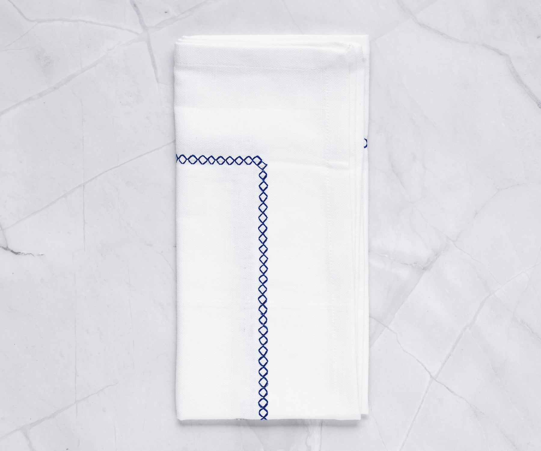 White hemstitch napkins can be mixed and matched with other table linens
