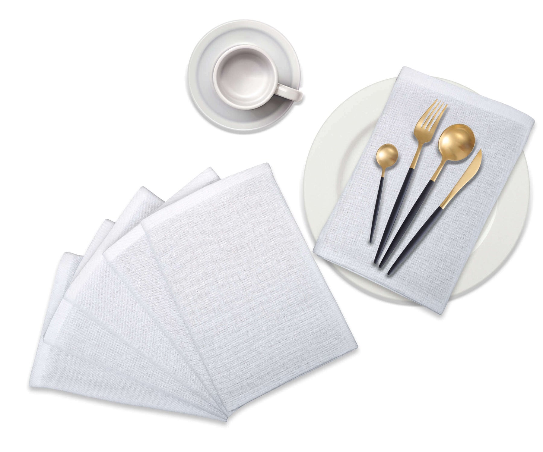 Folded white napkins with borders are placed on the table with a spoon.