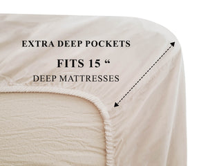 Close-up view of cotton fitted sheet with extra deep pockets measurement