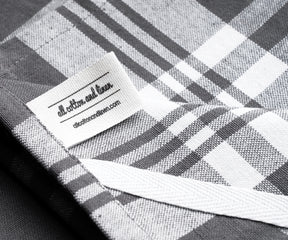 Close-up of a grey and white checked farmhouse kitchen towel