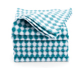 Colorful cotton kitchen towels hanging on a rack, ready to tackle any mess.