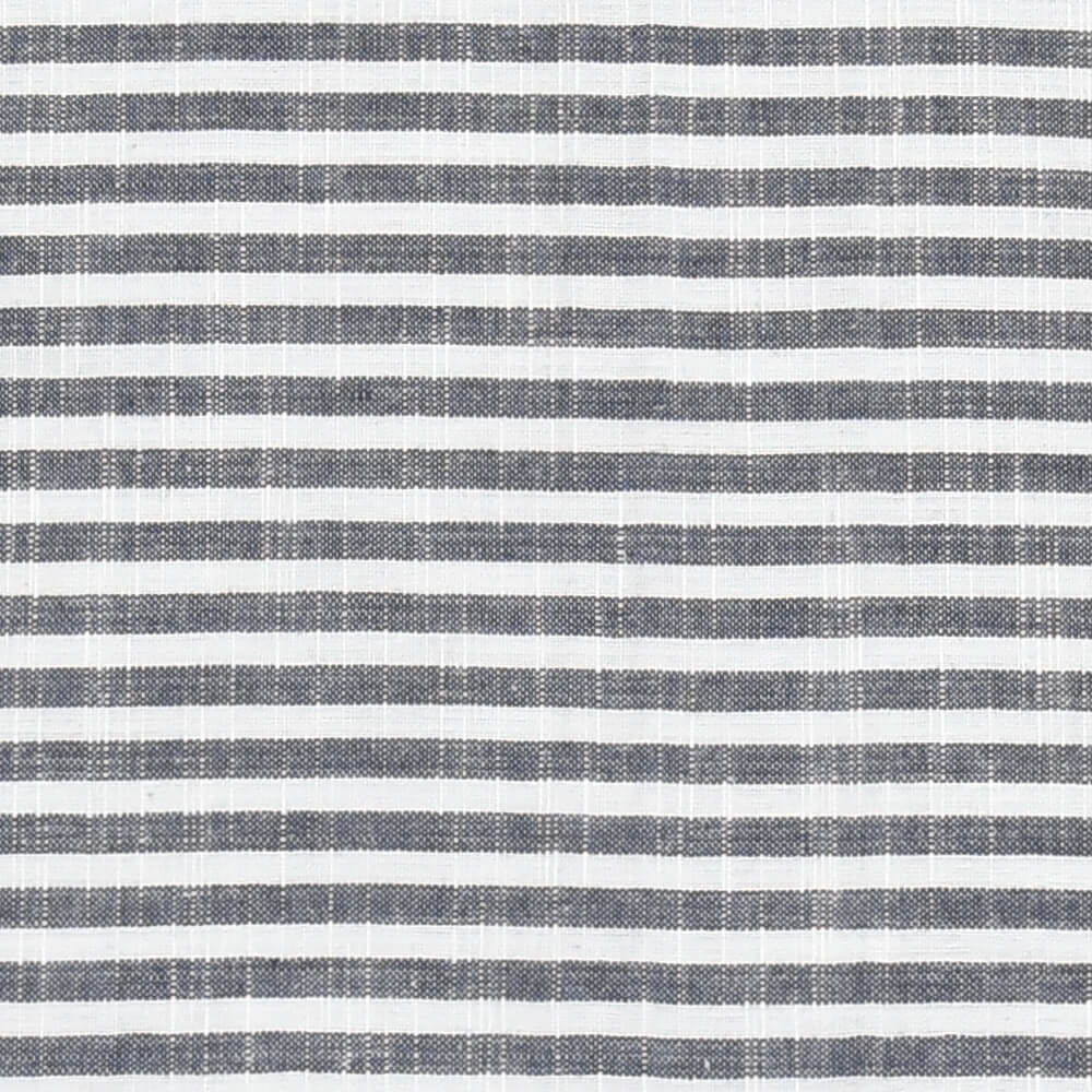 Close-up view of a blue and white striped restaurant napkin