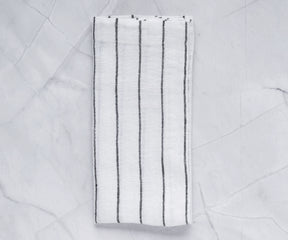 Linen dinner napkins in white, offering a luxurious and refined touch to the dining experience.