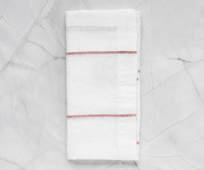 Add elegance to your table with cloth dinner napkins, showcasing various folding techniques and made from soft cotton. Discover festive Christmas designs and explore the art of creating captivating dinner napkin folds.