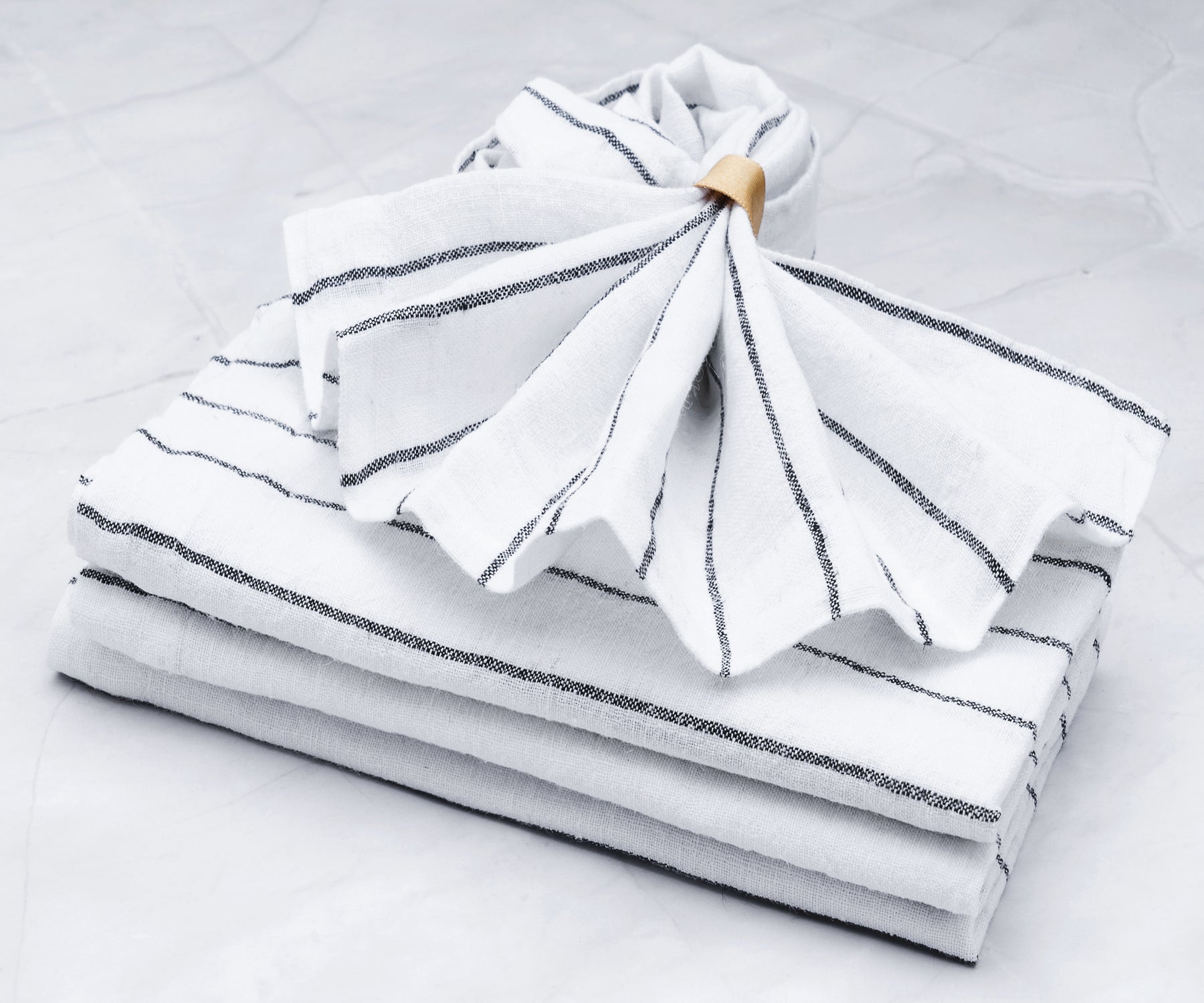 Bulk pack of cloth dinner napkins, ensuring an ample supply for large gatherings.