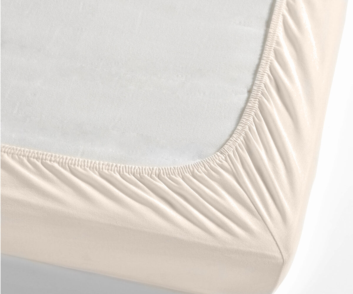 Detailed shot of a cotton fitted sheet on a mattress