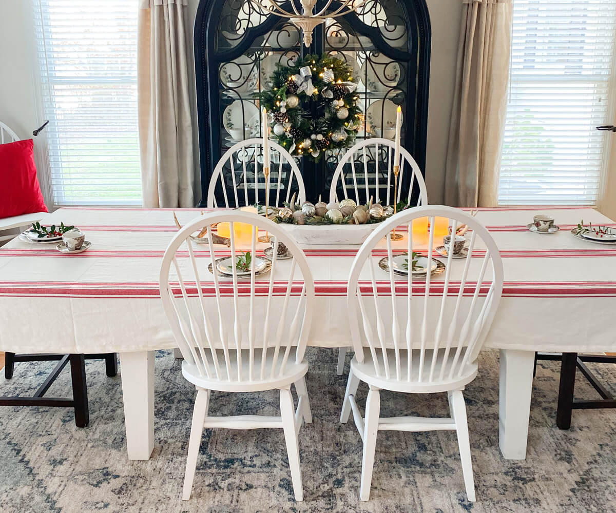 Farmhouse style tablecloth with red and white stripes on a dining table