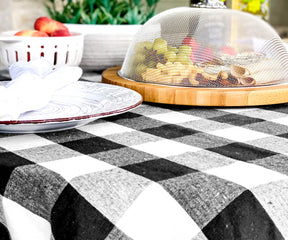 Round tablecloth with a black and white buffalo check pattern