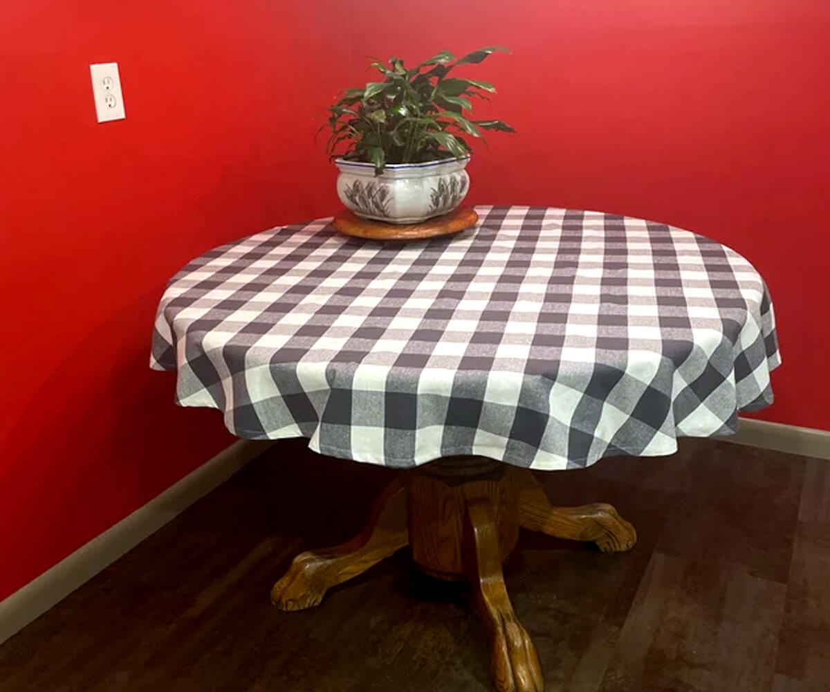 Round tablecloth with a plaid pattern and watermelon-themed decor