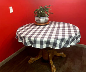 Round tablecloth with a plaid pattern and watermelon-themed decor