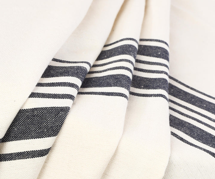 A round white tablecloth adds a touch of sophistication and charm to your dining experience.