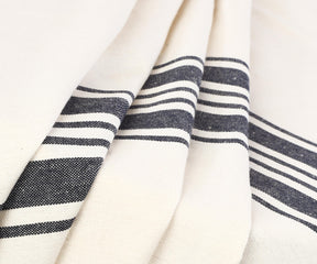 A round white tablecloth adds a touch of sophistication and charm to your dining experience.