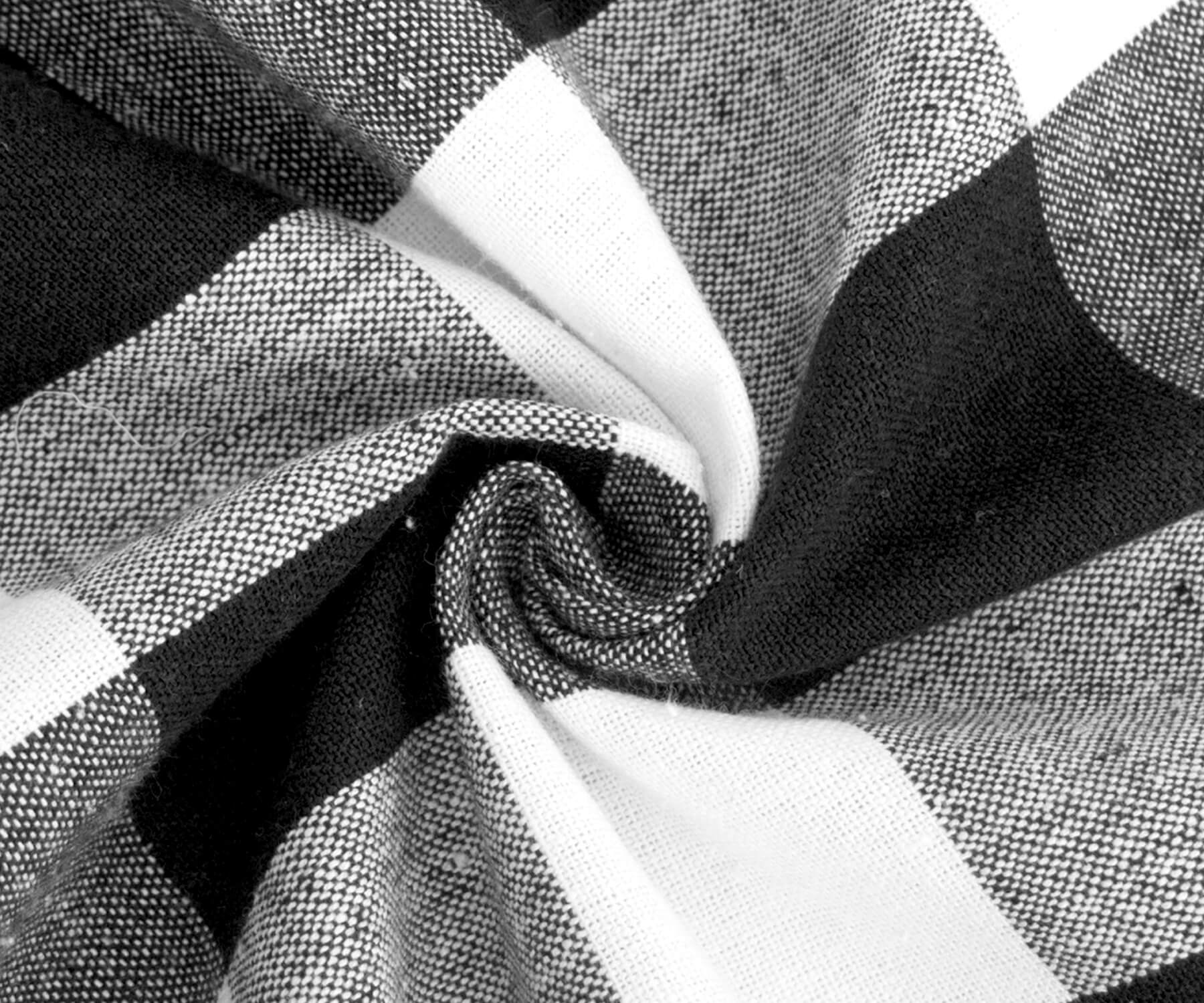 Black and white checkered round tablecloth fabric close-up