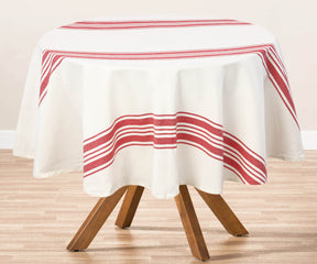 Round outdoor table with a red and white striped tablecloth