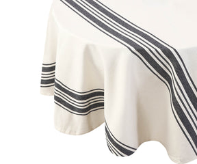 Round outdoor tablecloth with black and white stripes displayed on a table
