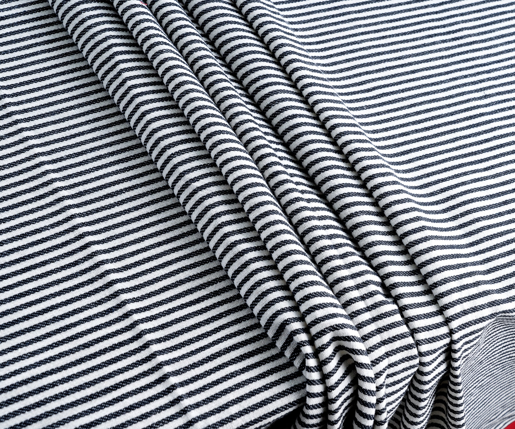 Close-up view of black and white striped Farmhouse tablecloth fabric
