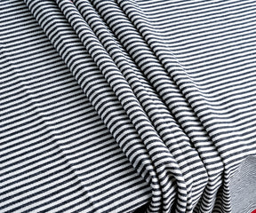 Upgrade your table aesthetic with a black & white cotton tablecloth, or celebrate Halloween with a thematic design, creating a captivating atmosphere.