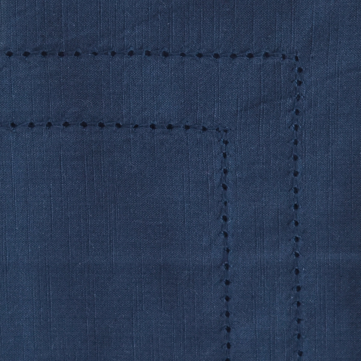 Close-up view of a blue double hemstitch cloth napkin with hemstitch details