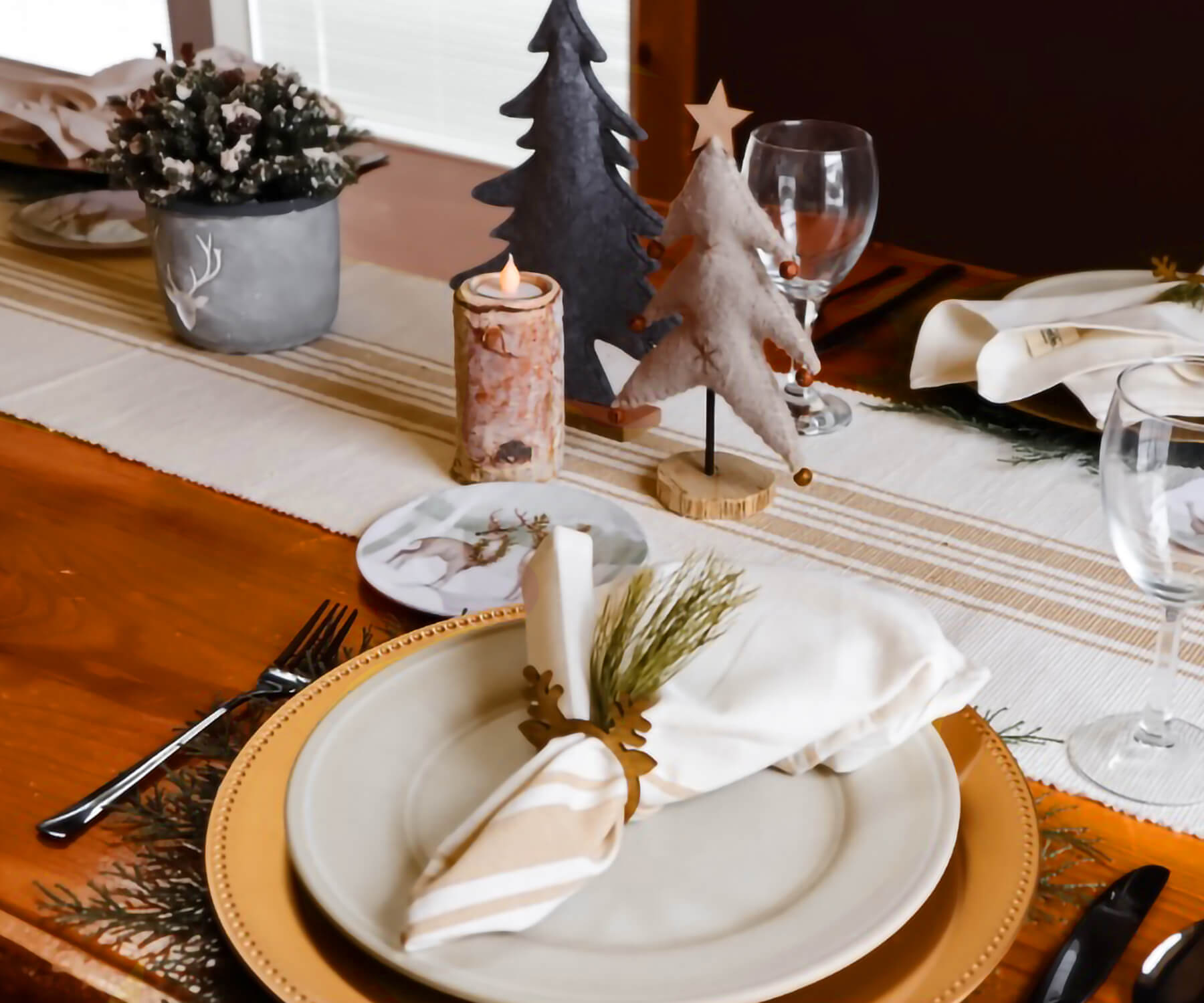 White cotton napkins with Beige and cream striped - Farmhouse napkins  pattern are folded with grass & placed on the plate on the table.