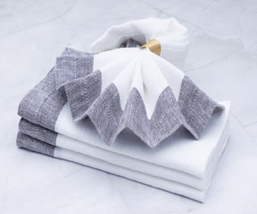 Soft linen dinner napkins displayed on dining table