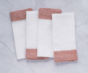 I offer linen napkins in bulk for your convenience. If you're hosting a cocktail party, consider our linen cocktail napkins. Need help with folding linen napkins? I can show you how. Additionally, personalize your dining experience with our monogrammed linen napkins.Cheerful Christmas cloth napkins enhancing the holiday spirit